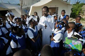 Priest with kids outside