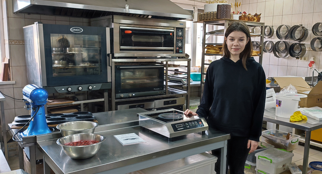 Sofia runs her own small bakery after receiving business training and a micro-grant through an IOCC program.